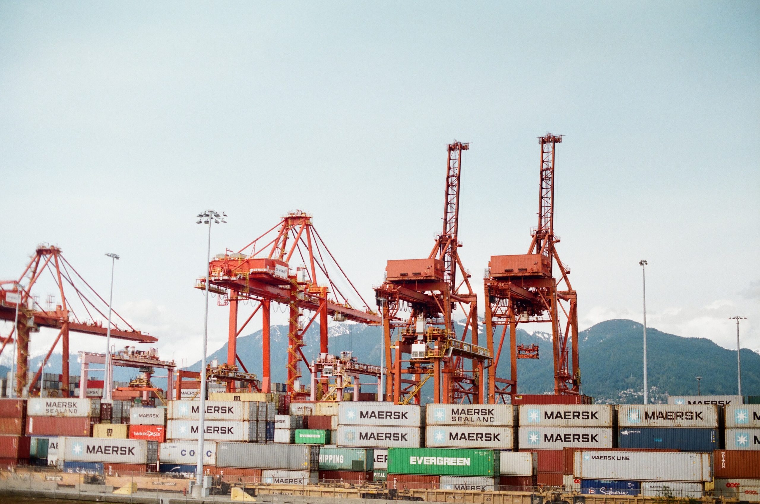 shipping containers and cranes in vancouver canada stand still due to canadian port strike