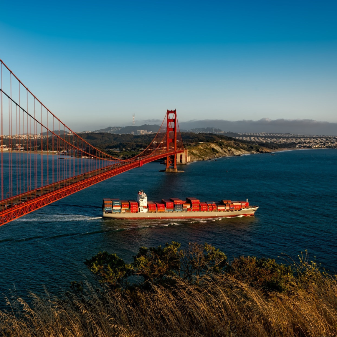 Shipping container ship passes under the Golden Gate Bridge in San Francisco