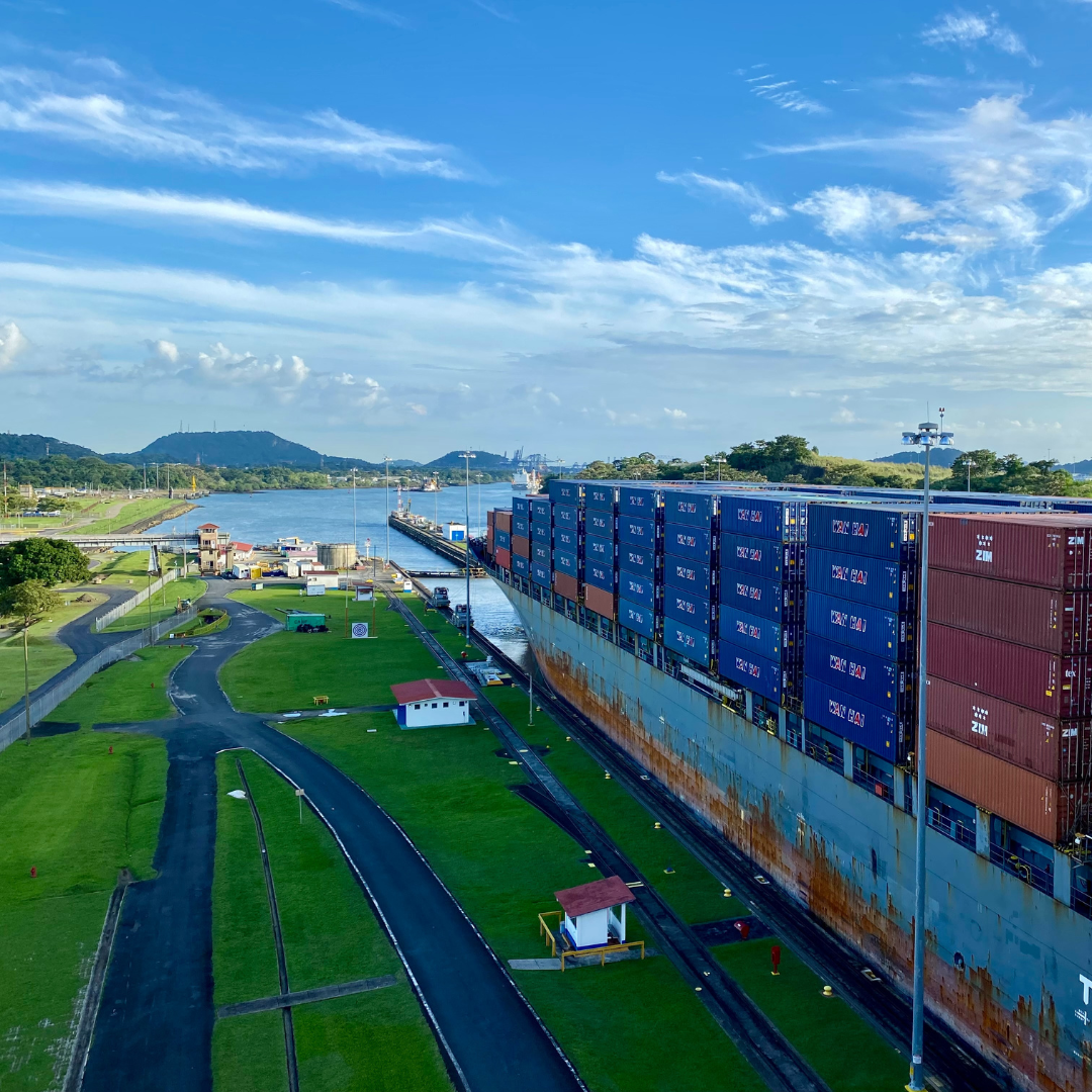 A container ship passing through the Miraflores Locks in the Panama Canal.