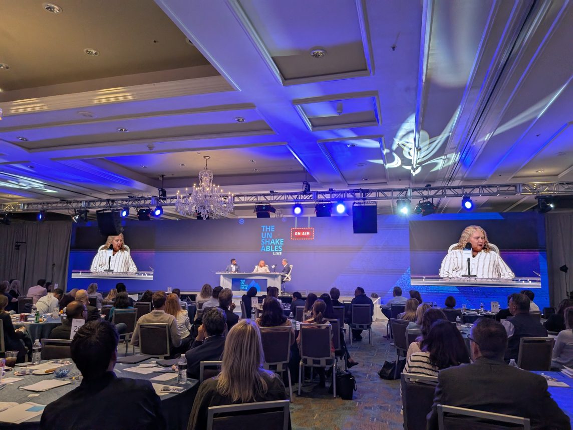 Michelle Rockwell on stage at a live recording of The Unshakeables, Chase for Business podcast